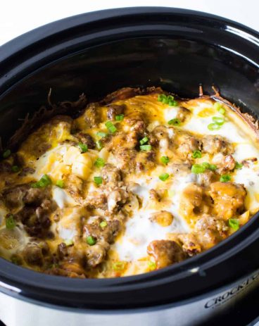 Slow Cooker Breakfast Casserole. This quick and easy to put together breakfast can cook in the slow cooker overnight while you're sleeping!! There's nothing better than waking up to the smell of a homemade breakfast already made. This casserole is loaded up with sausage, diced hash browns, eggs and cheese.