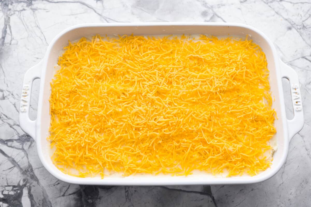 Meat and glaze mixture covered with mashed potatoes and shredded cheese. 