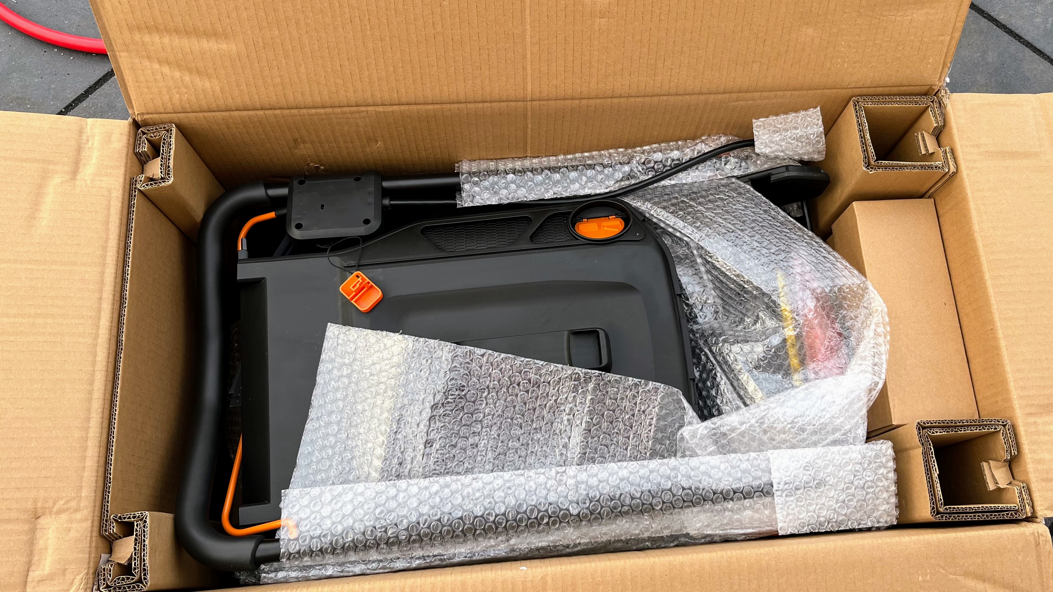 Worx WG743 POWER SHARE 40-Volt 17 in. Cordless Mower being tested in writer's home