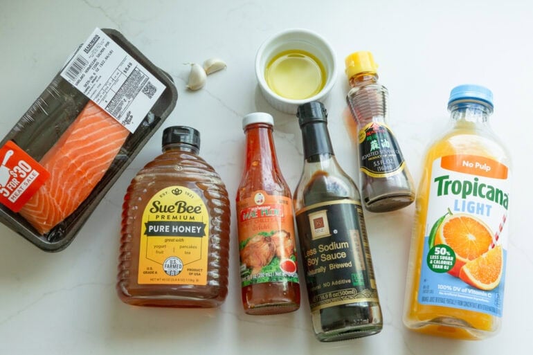 all the ingredients for the best salmon marinade sitting on a white table