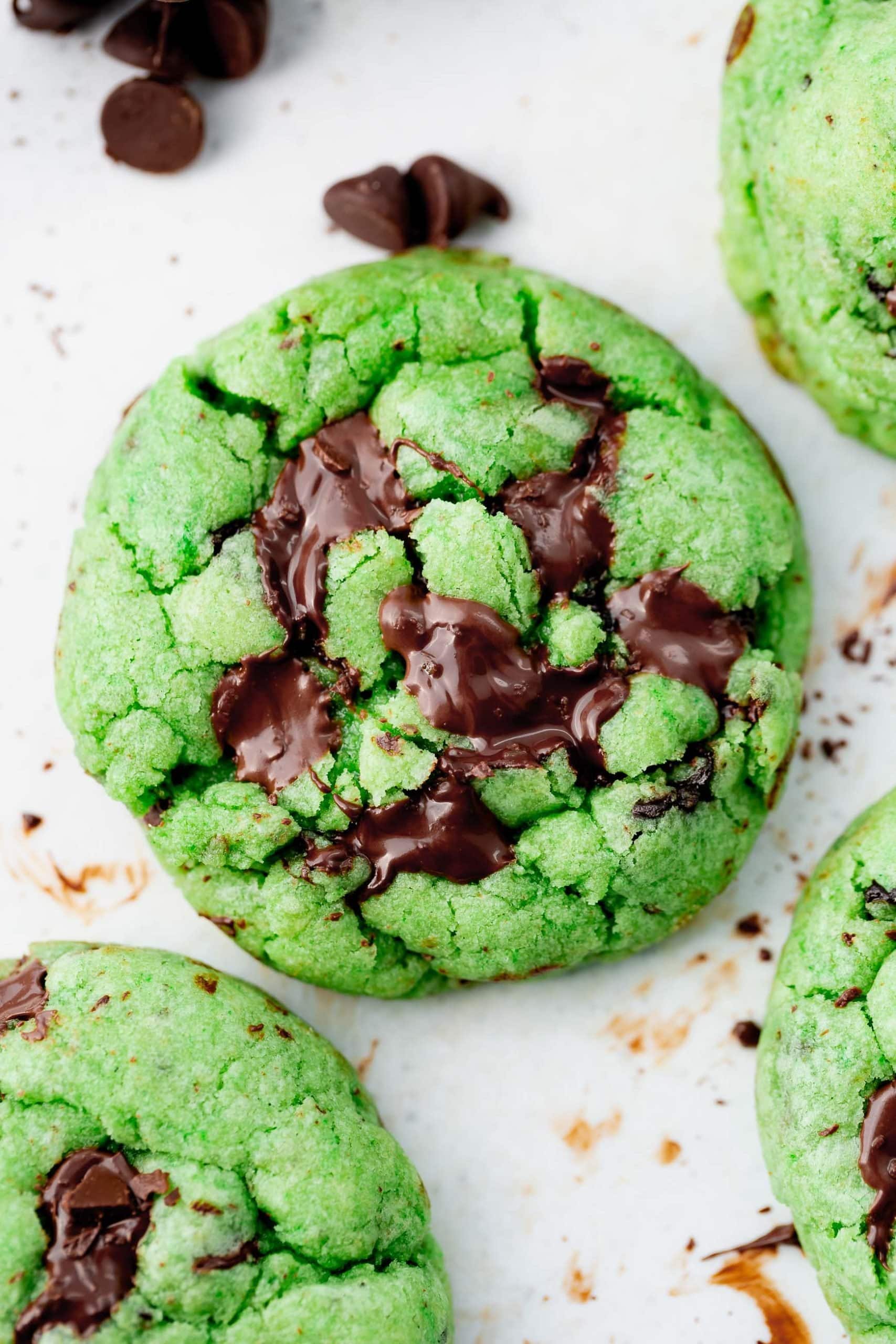 a close up photo of green mint chocolate chip cookie.