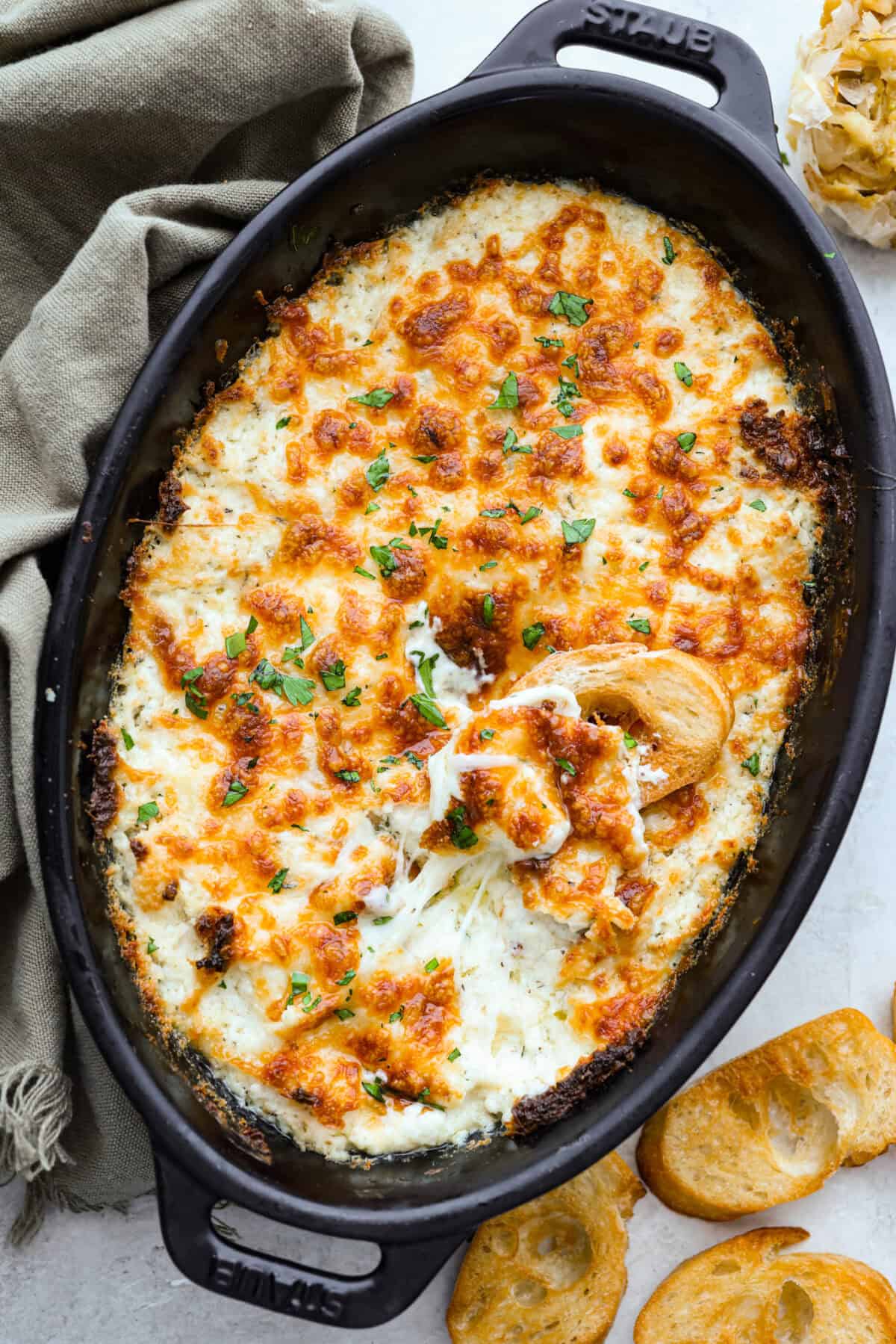 Overhead shot of the baked cheesy garlic bread dip. 