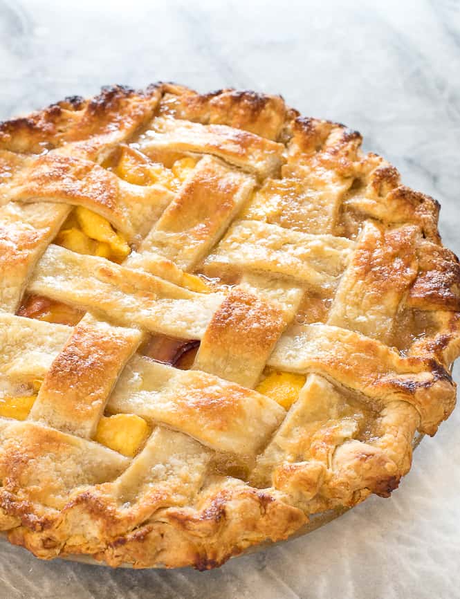Homemade Peach Pie baked with a lattice top. 