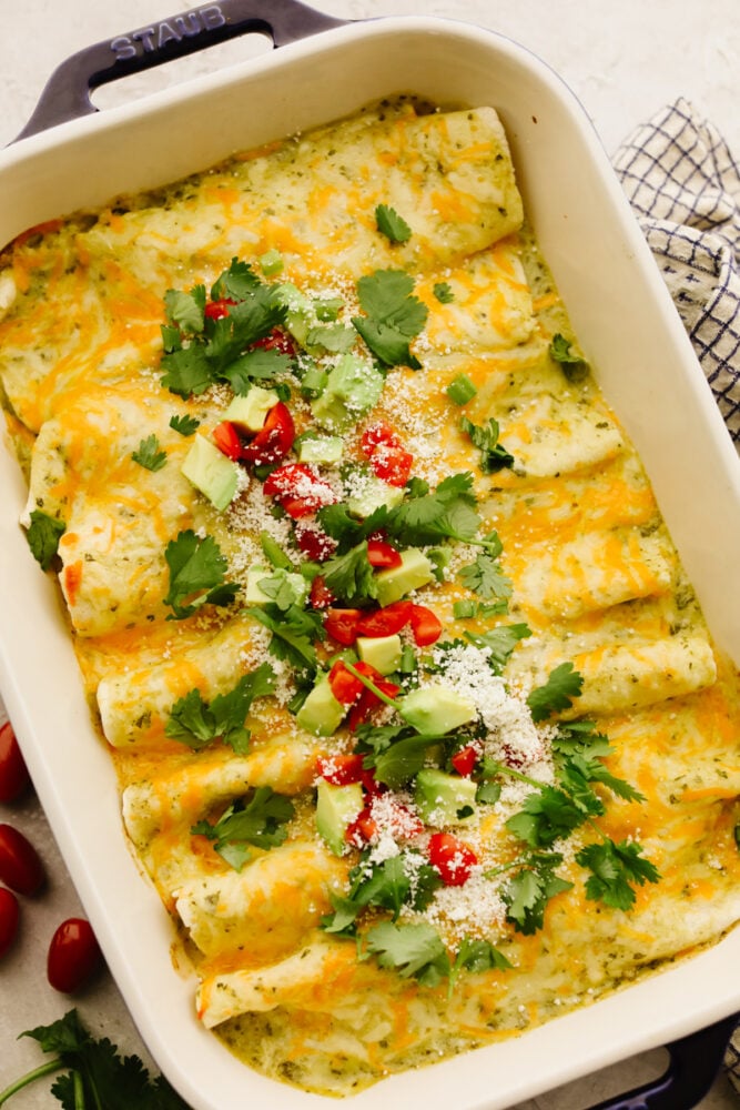 A casserole dish filled with breakfast enchiladas. 