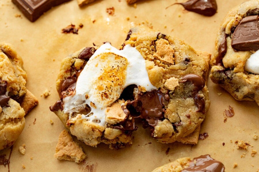 a gooey chocolatey s'more cookie with a golden marshmallow stuffed in the middle