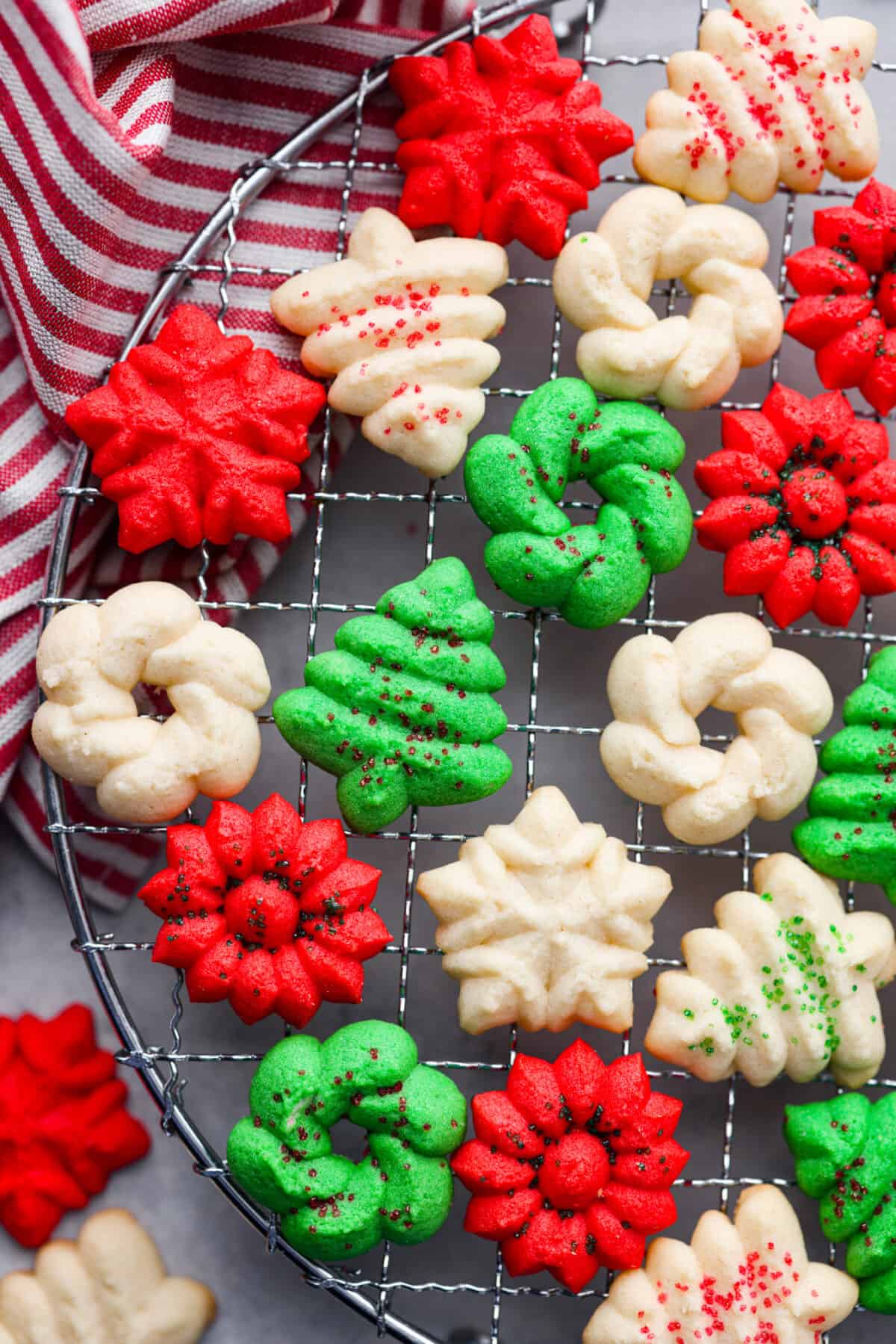 Closeup of spritz cookies on a cooling rack.