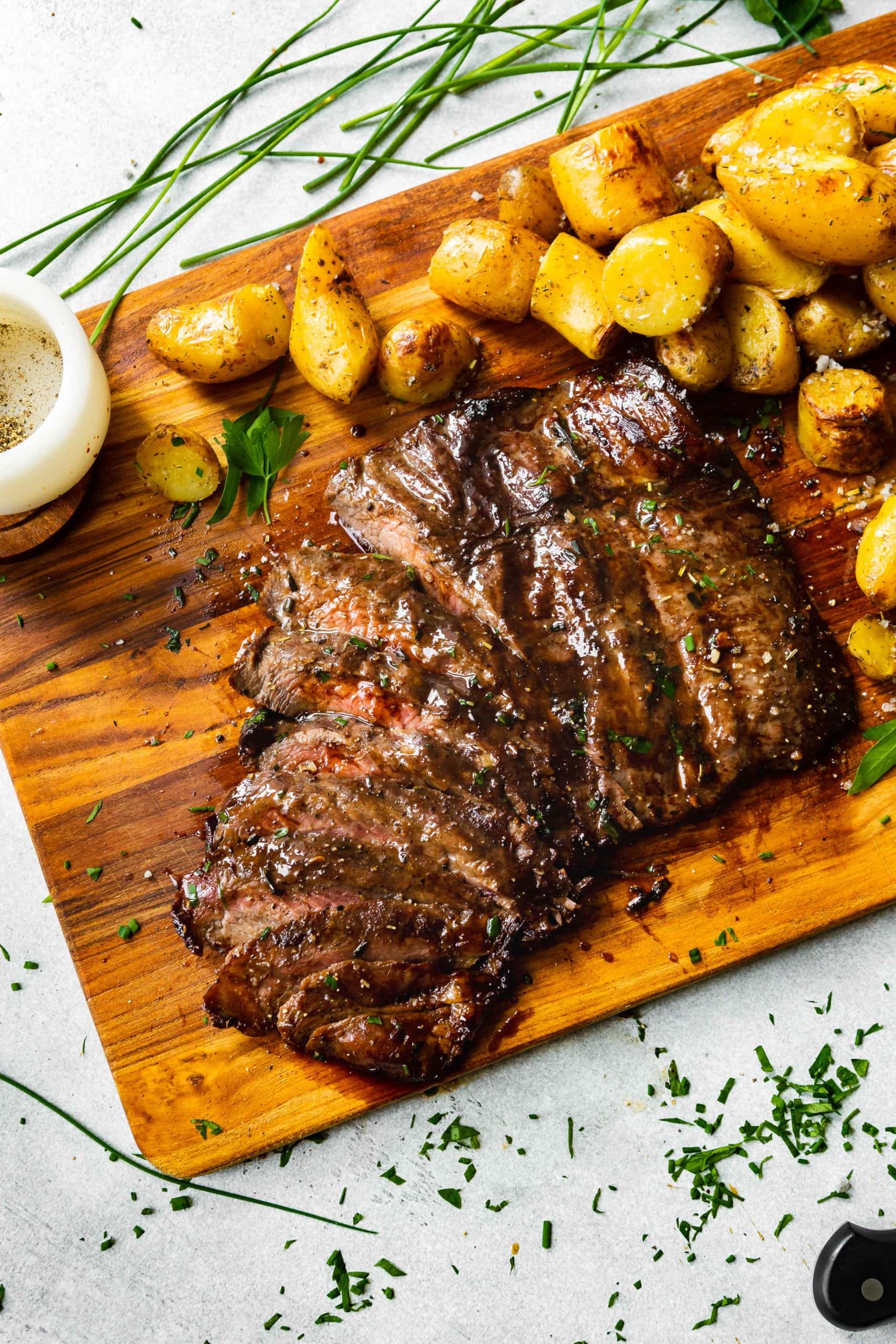 roasted yukon gold potatoes with a grilled flank steak sliced thinly