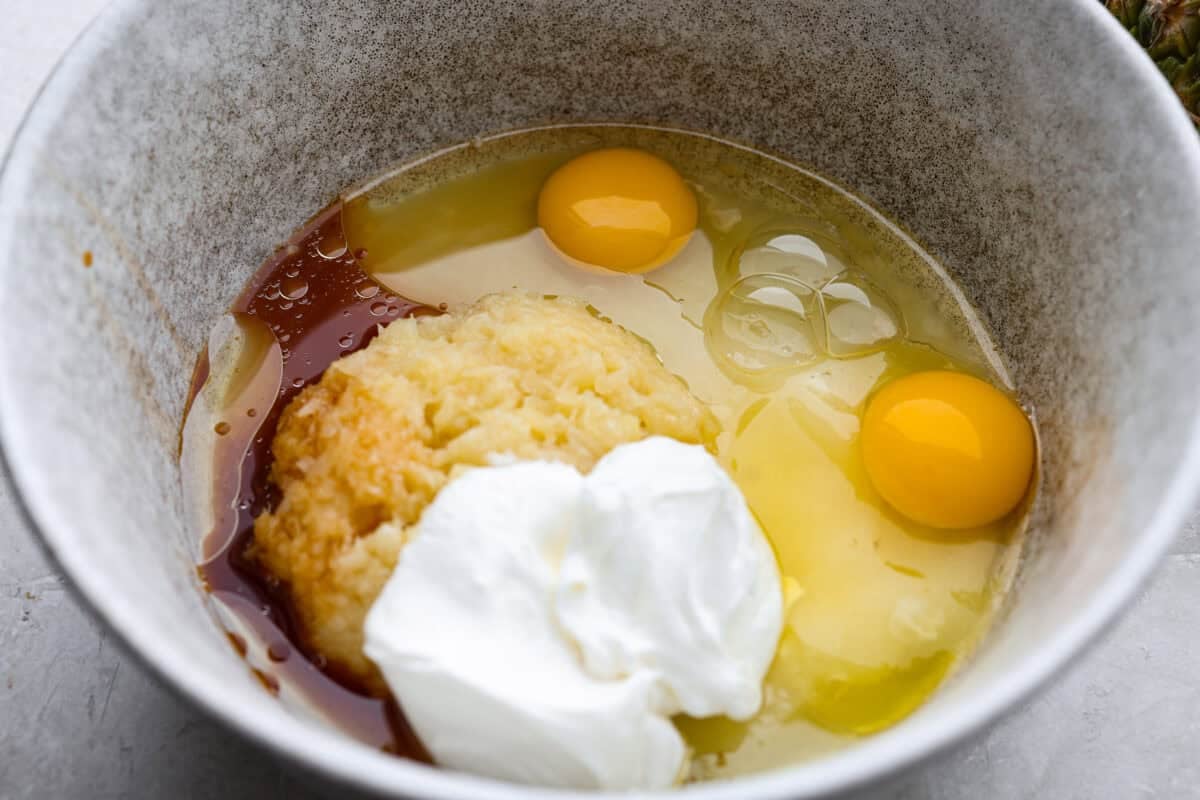 Wet ingredients added to a bowl. 