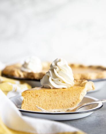 A slice of sweet potato pie on a plate