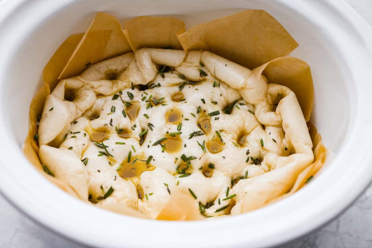 Roll dough pierced with fingertips and covered in olive oil and herbs. 