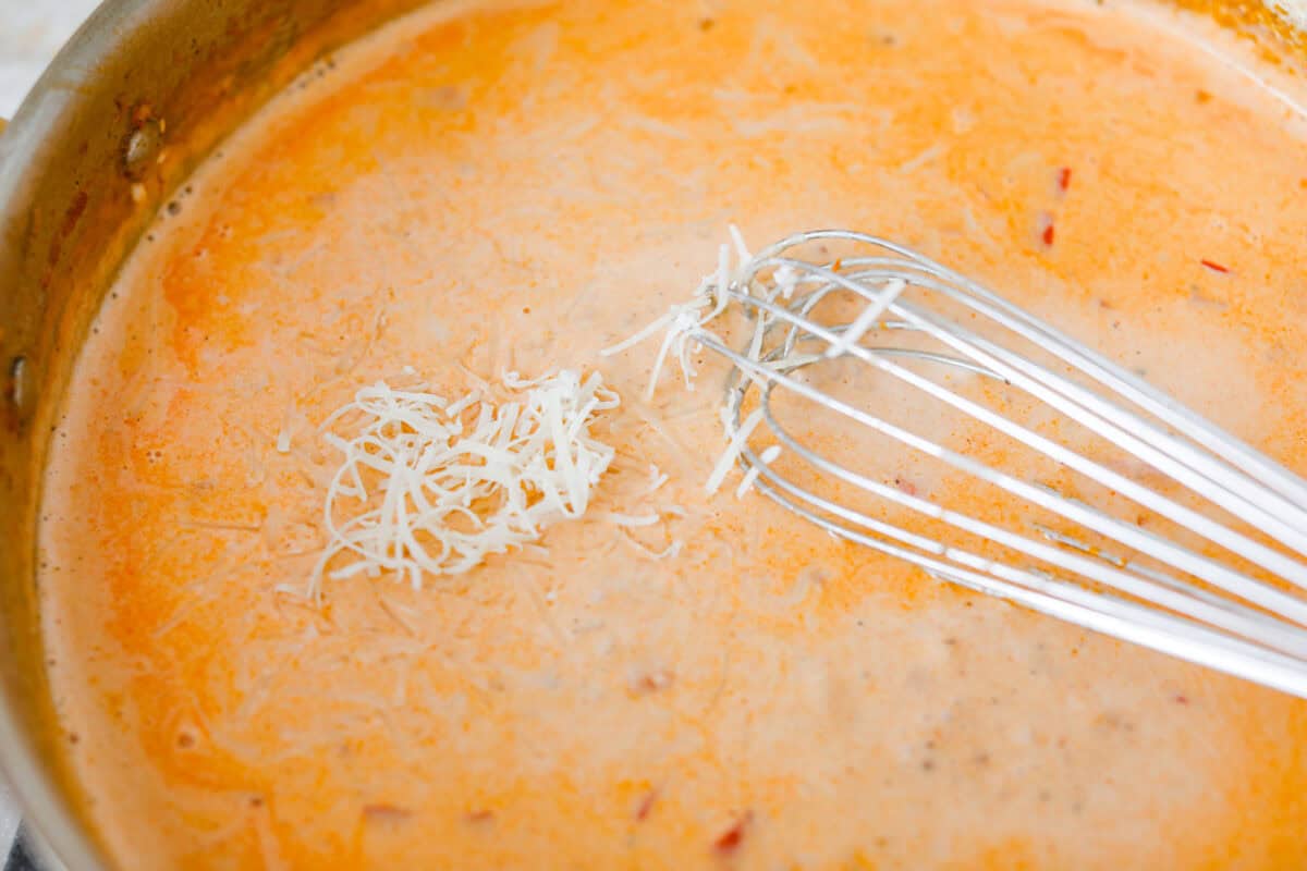 Someone whisking in the cheese 