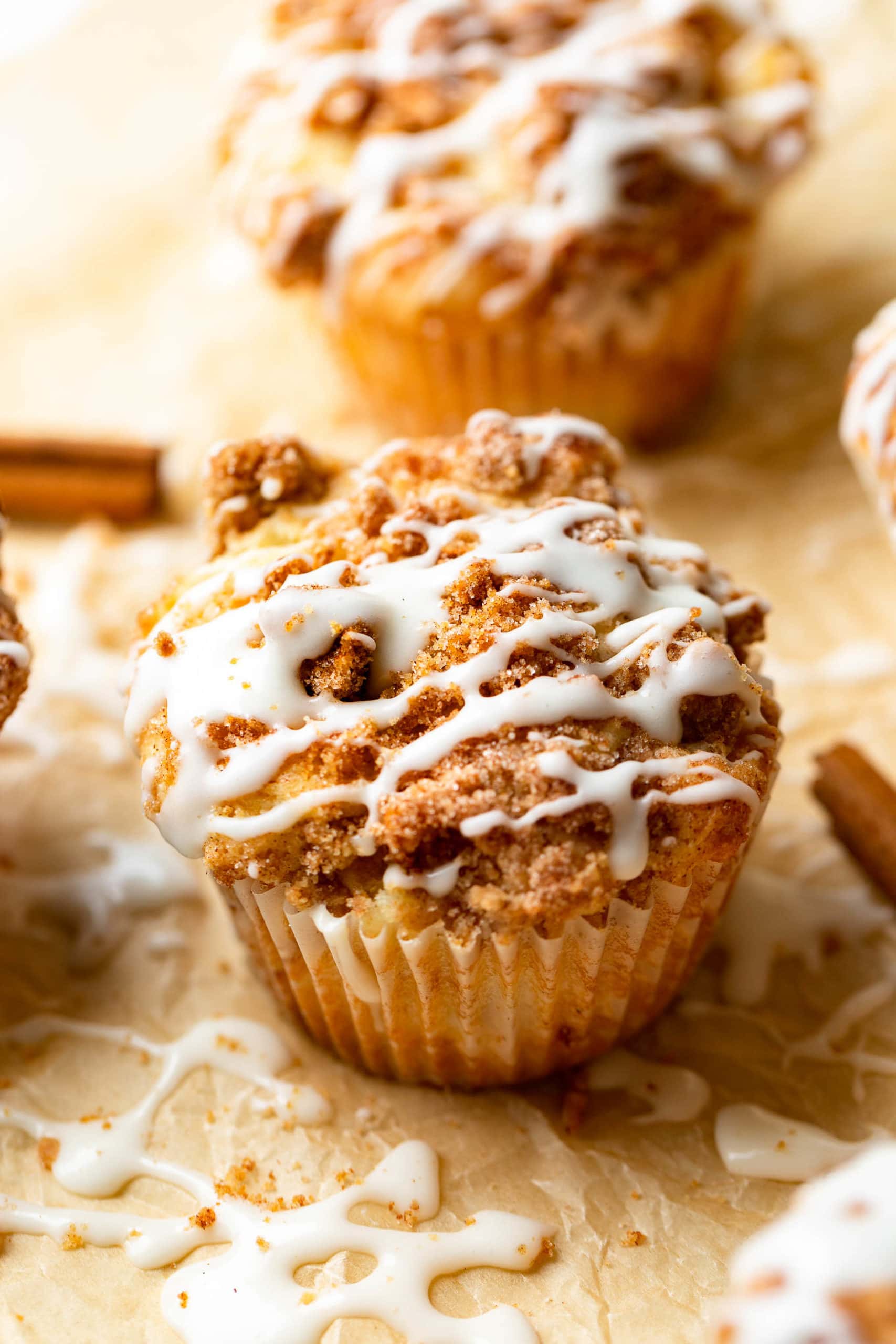 an apple coffee cake muffin with streusel and icing