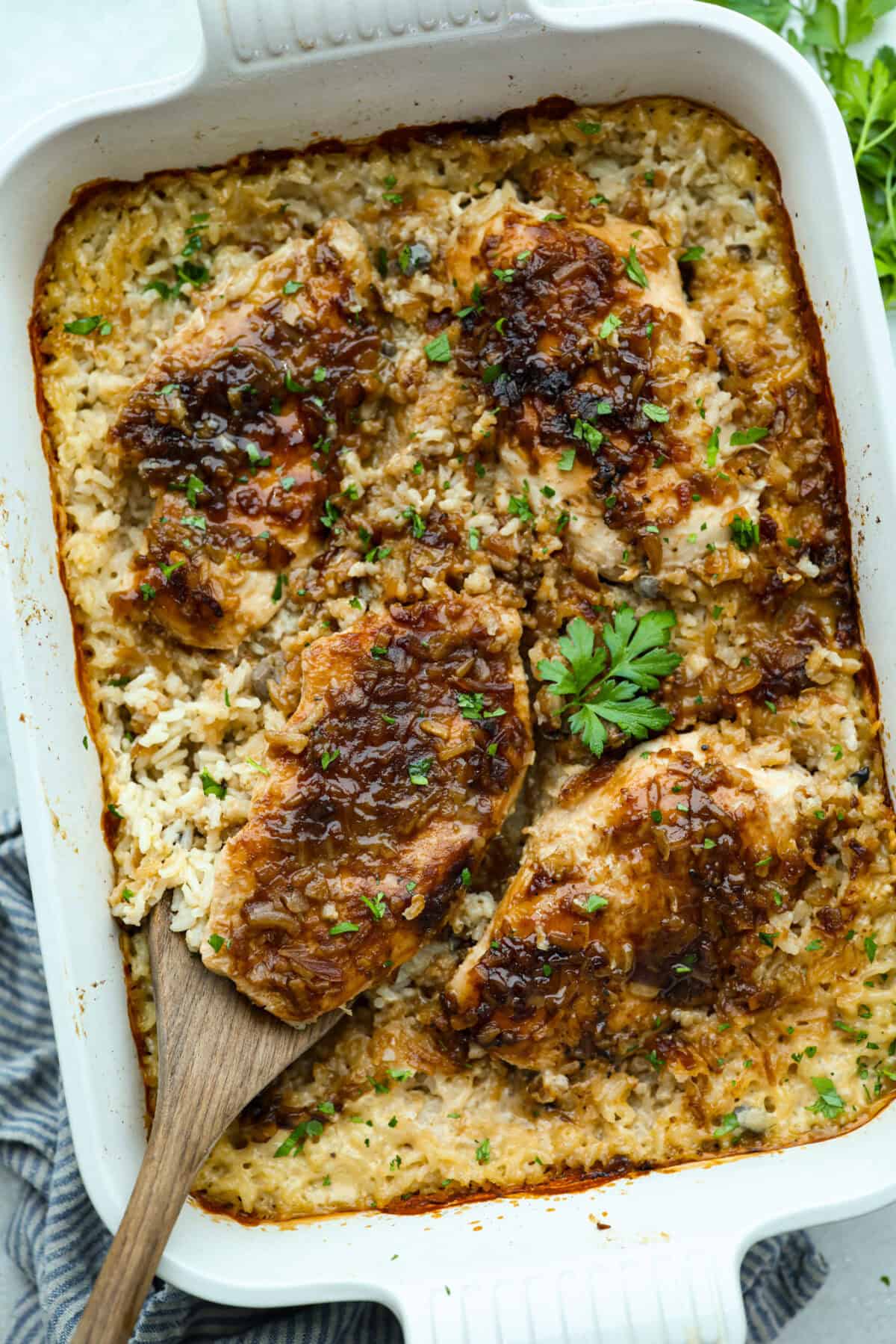 Baking dish filled with no peek chicken and rice casserole. 