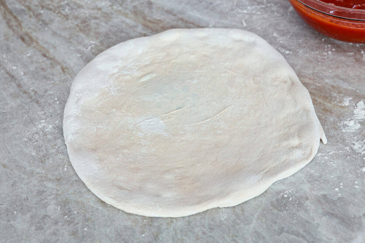 Fourth photo of the finished 12 pizza round ready for toppings.