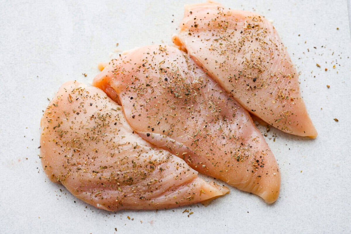 Chicken breast pounded and seasoned. 