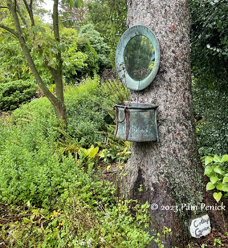 33_Copper_pot_mirror_on_tree.jpg