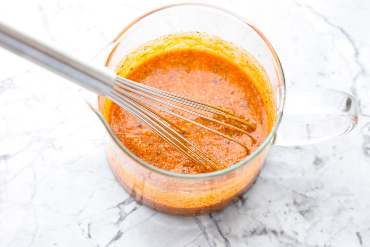 All of the sauce ingredients whisked together in a pouring container. 