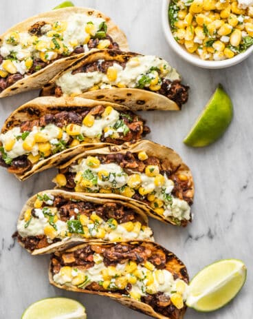 black bean tacos with lime wedges and corn salsa