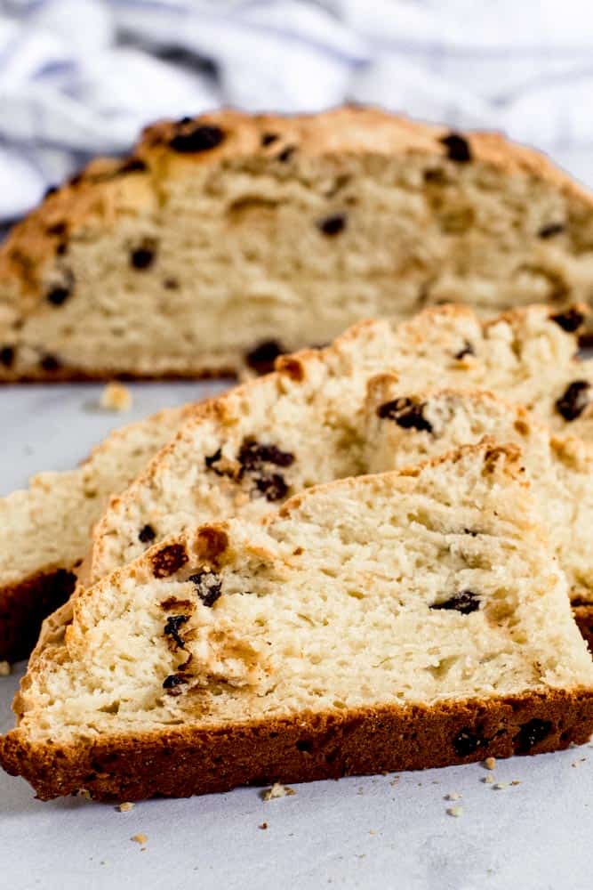 soda bread slice with loaf behind