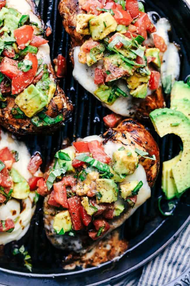 Grilled California Avocado Chicken close up in a black skillet.