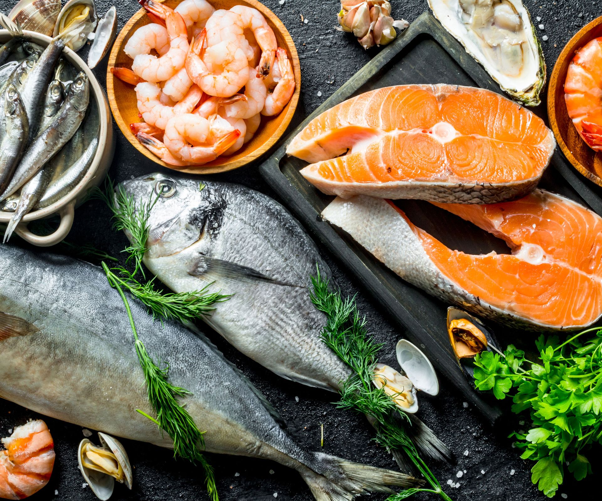 seafood platter with prawns, oysters, anchovies, salmon and large fish