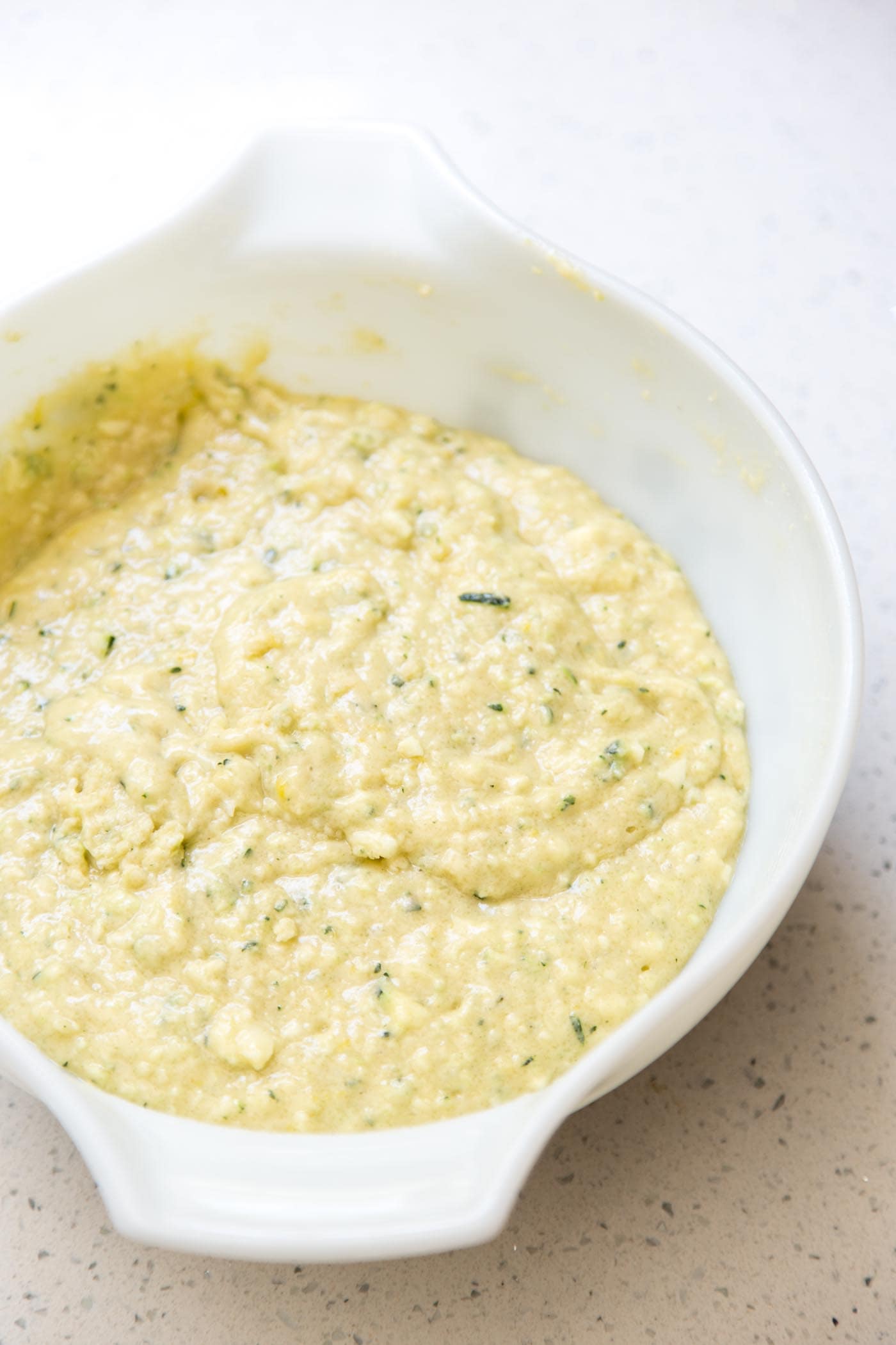 Lemon zucchini bread batter in a mixing bowl