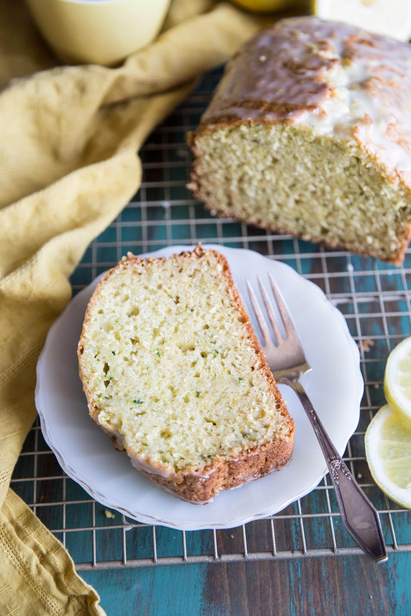 Sliced lemon zucchini bread on a wire rack