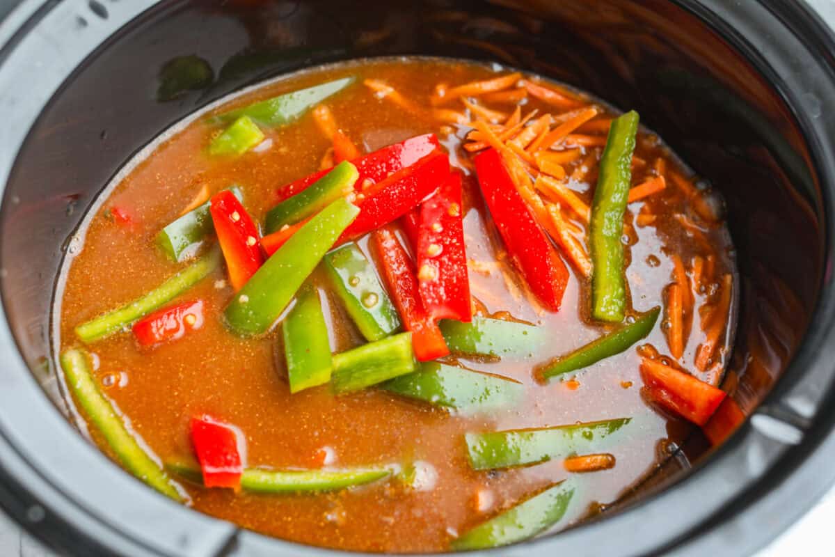 Broth added to the crock pot. 