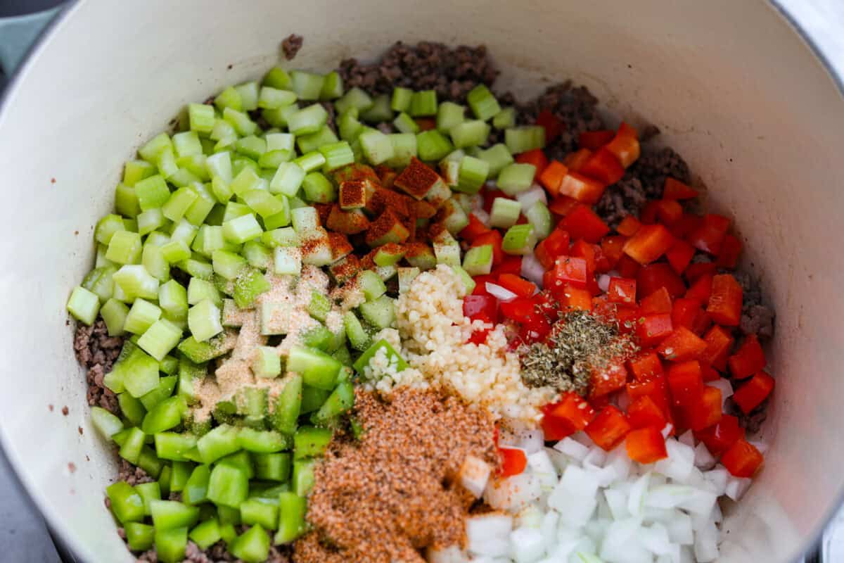 Veggies and seasonings added to the ground beef. 