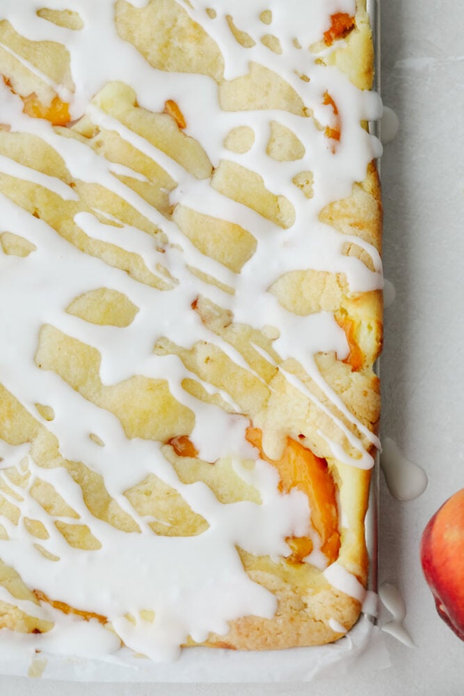 An overview photo of the peaches and cream pie bars in a sheet pan. 