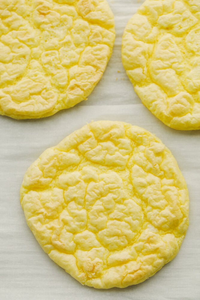 Baked cloud bread on parchment paper. 