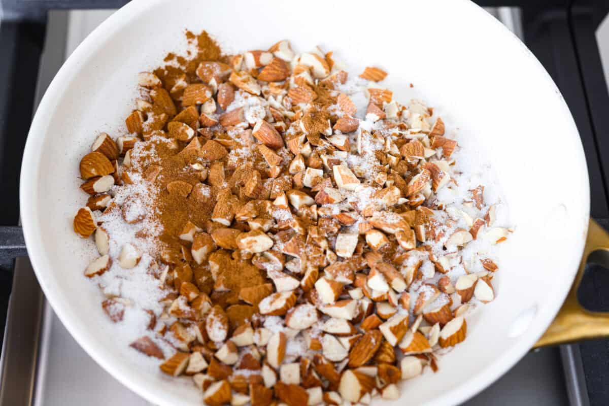 Pan with sugar, cinnamon, and almonds. 