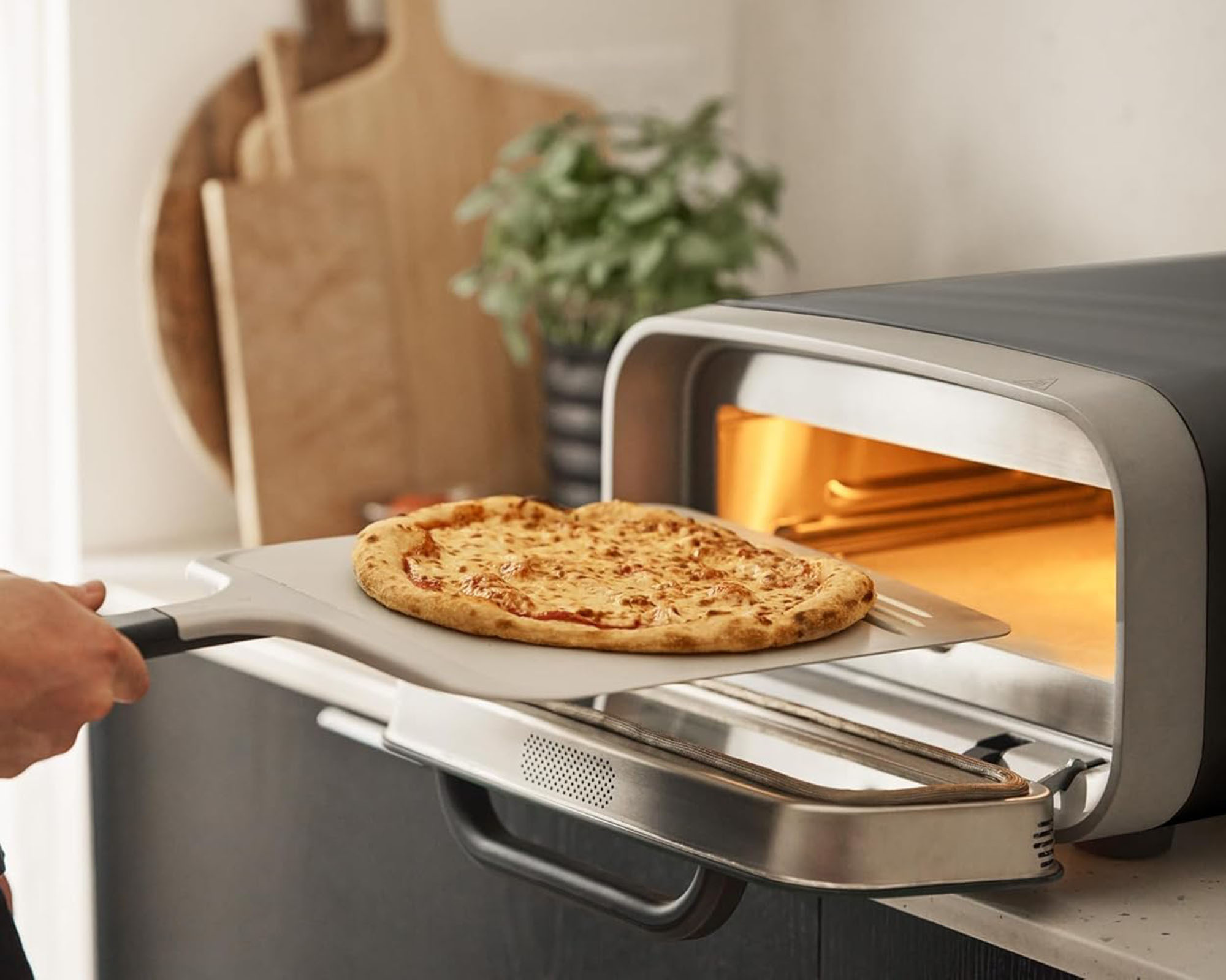 Ooni Volt 2 pizza oven in use in kitchen