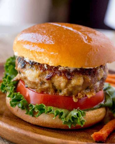 Spinach Feta Turkey Burgers with fresh spinach, salty crumbled feta cheese and a super tender turkey patty topped with lemony greek yogurt.