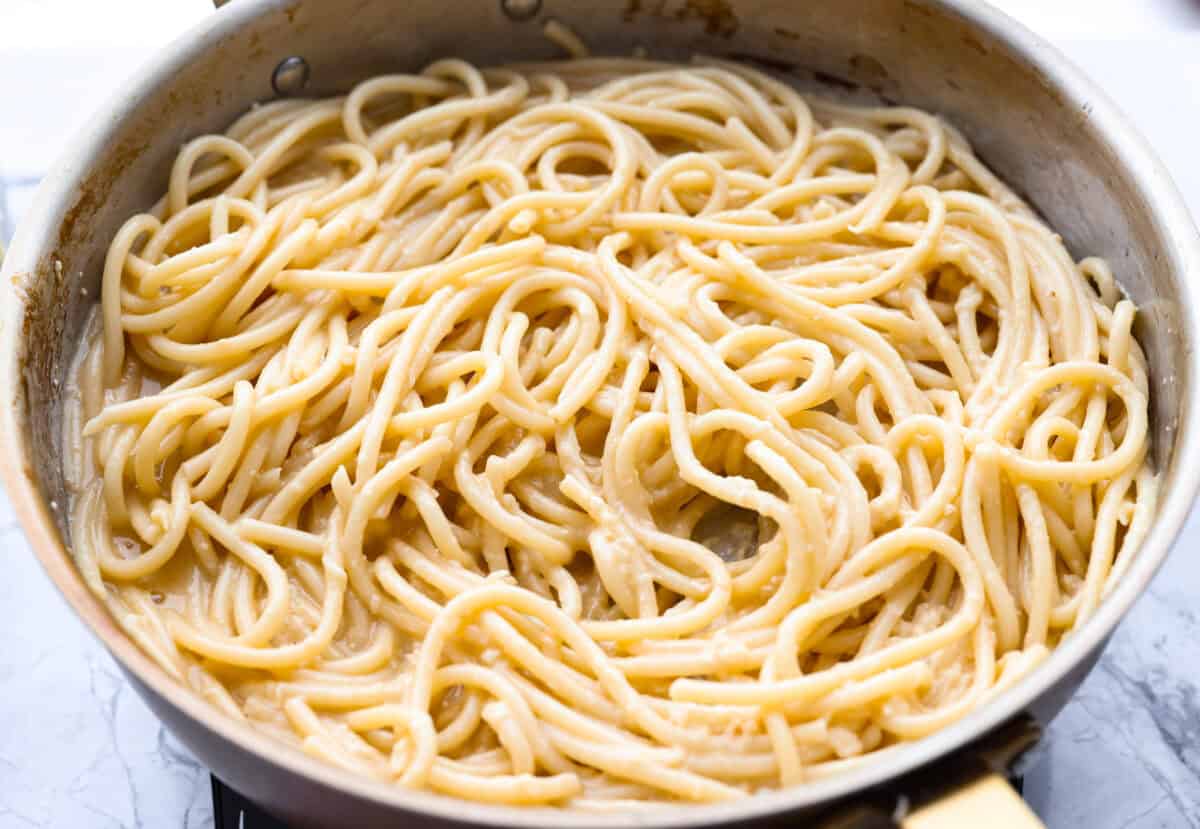 Cooked noodles added to the skillet. 