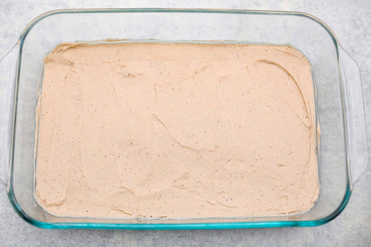 Cream cheese layer spread over the graham cracker crust.