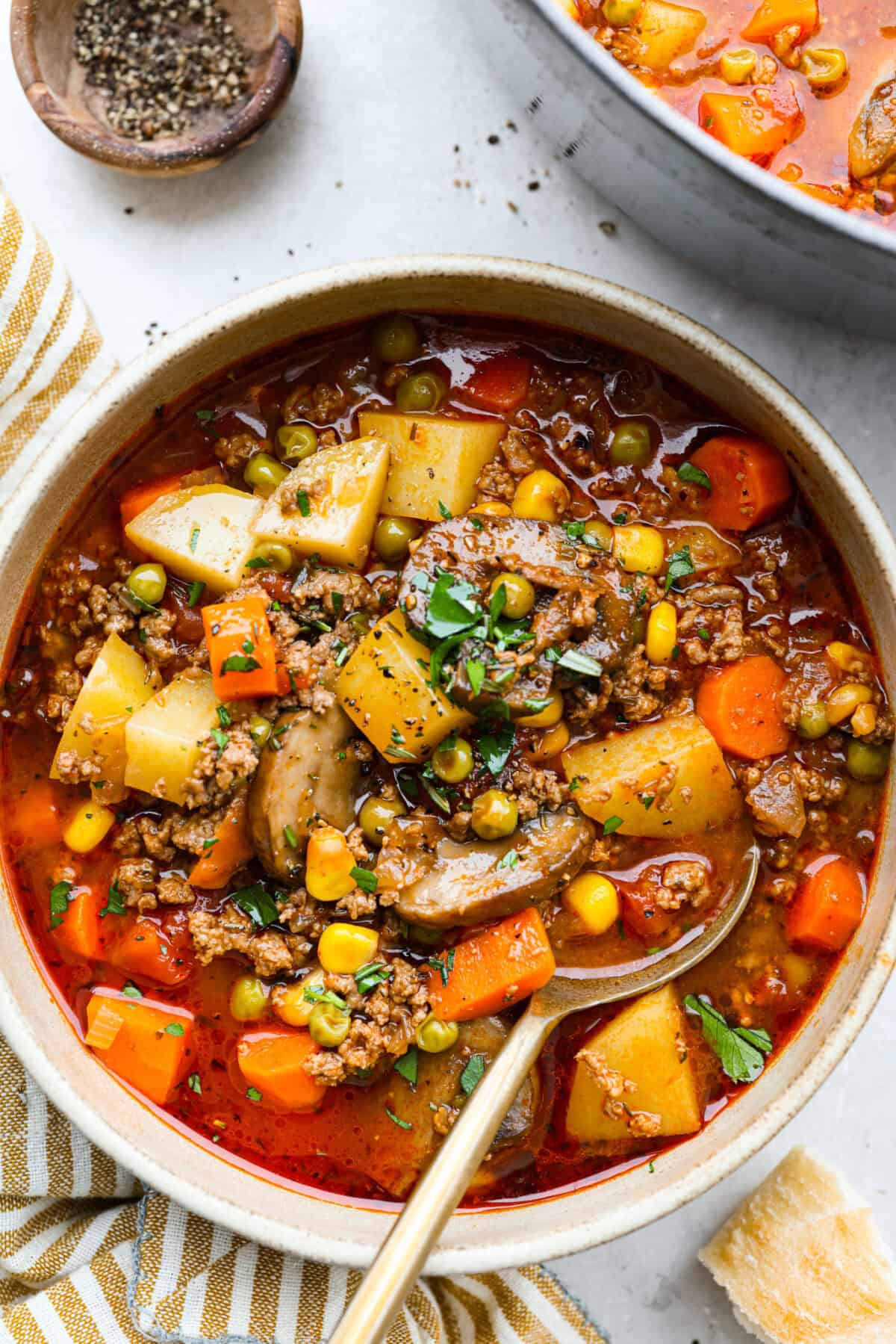Bowl of hobo stew with gold spoon.