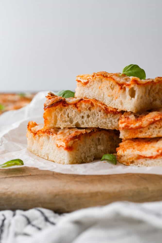 Slices of pizza stacked on top of each other.