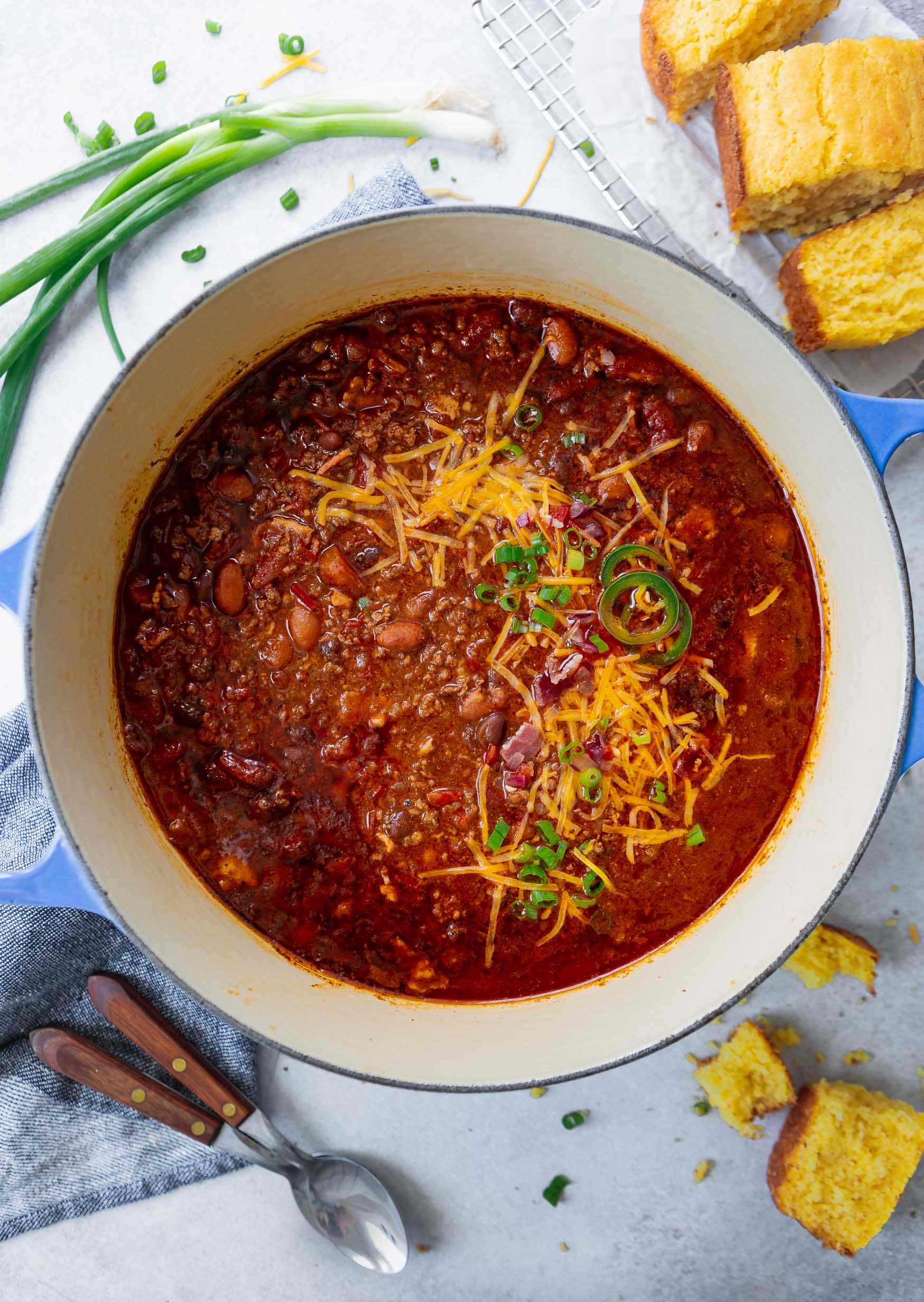 A bowl of Best Chili topped with grated cheese and cilantro.