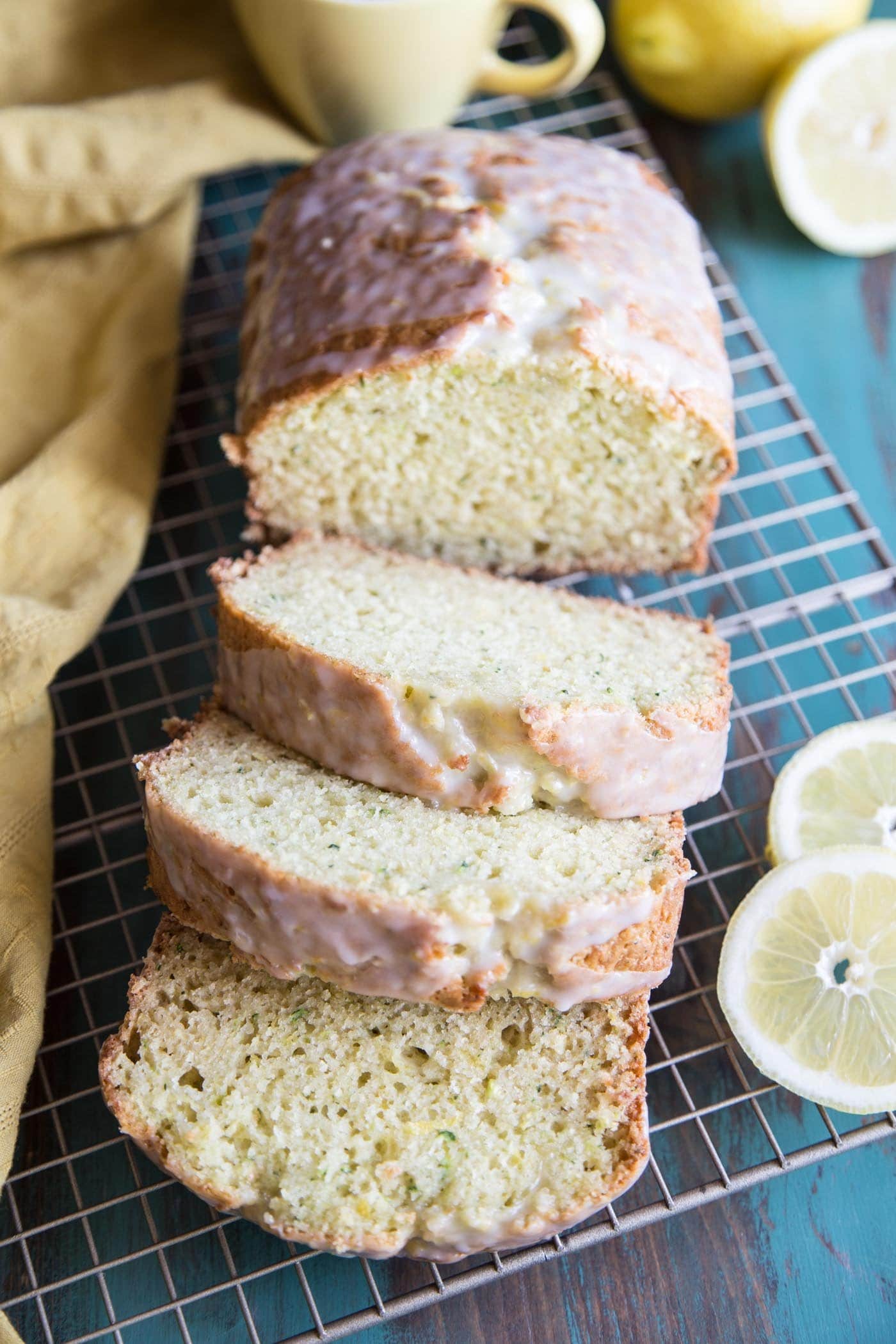 Sliced lemon zucchini bread on a wire rack