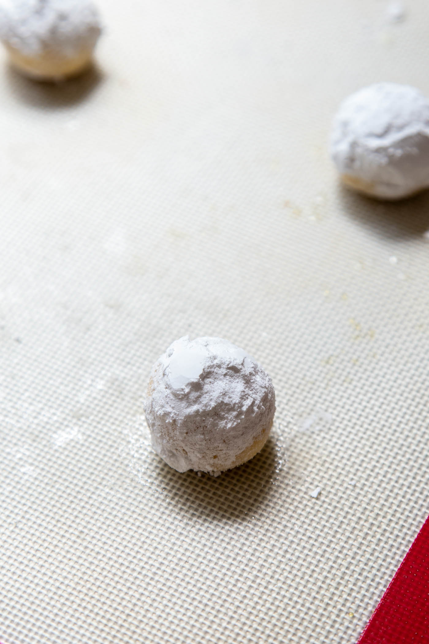 Unbaked lemon cookie dough balls rolled in sugar
