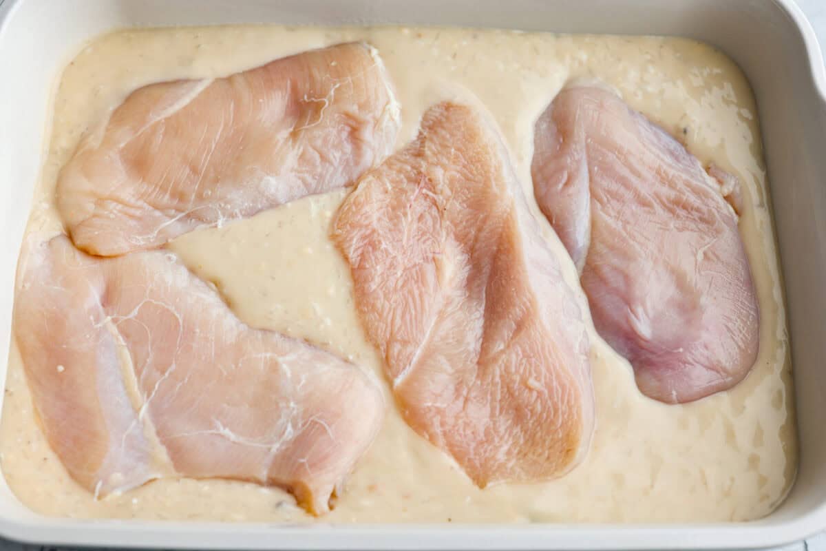 Chicken breasts added over the top of the sauce then seasoned. 
