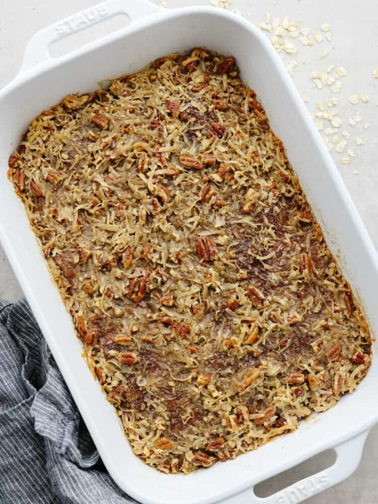 The top view of an oatmeal cake after it cooked in a white 9 x 13 pan. 