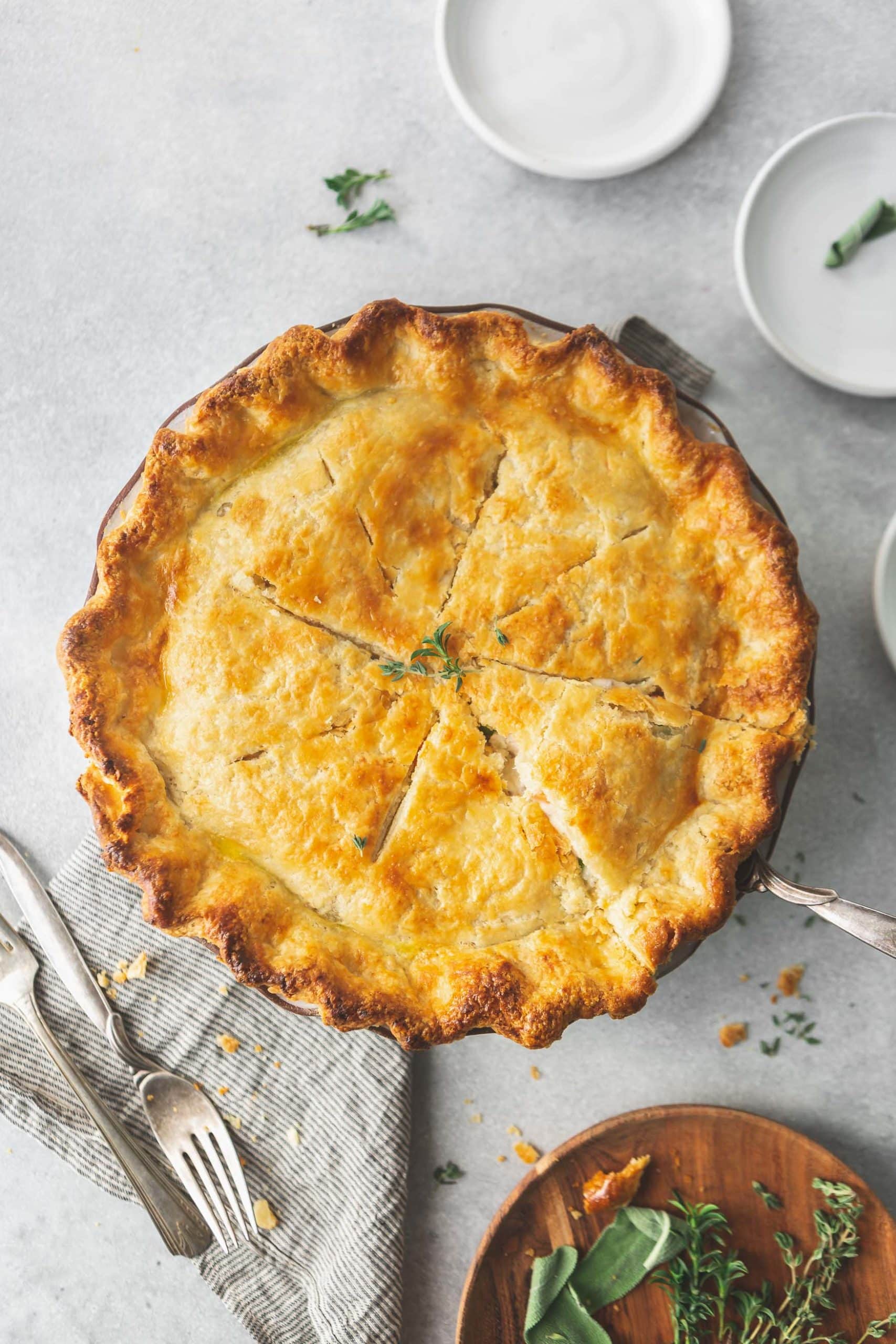 A overhead picture of a turkey pot pie. The crust is golden brown.