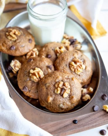 Banana cookies on a serving tray with milk