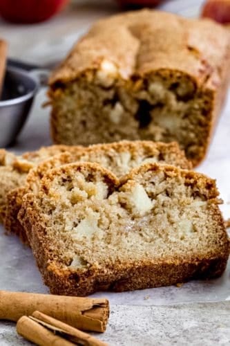apple bread slices with cinnamon sticks beside it