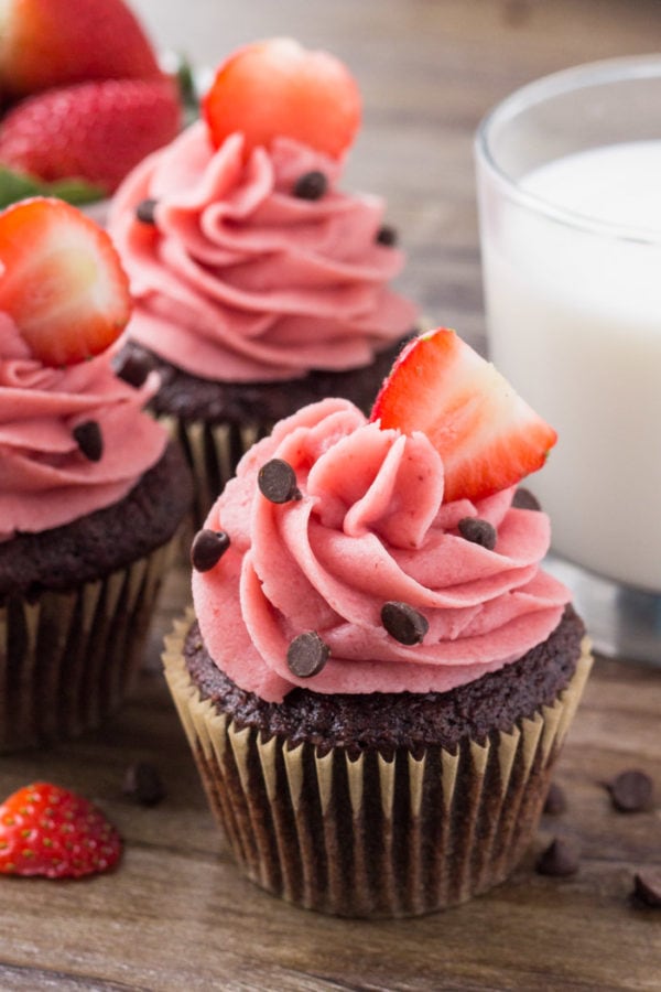 These chocolate cupcakes with strawberry frosting start with moist, fudgy chocolate cake. Then they're topped with creamy strawberry buttercream made from real strawberries. These chocolate cupcakes with strawberry frosting start with moist, fudgy chocolate cake. Then they're topped with creamy strawberry buttercream made from real strawberries.