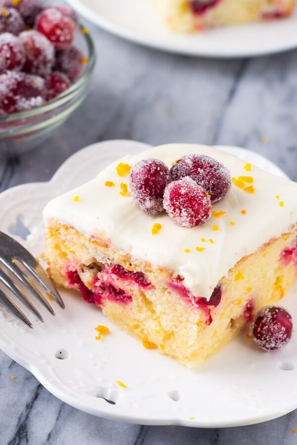 This cranberry orange cake with cream cheese frosting is bursting with holiday flavors. Perfectly moist with the softest cake crumb - the combination of sweet oranges and tart canberries makes it perfect for Christmas. This cranberry orange cake with cream cheese frosting is bursting with holiday flavors. Perfectly moist with the softest cake crumb - the combination of sweet oranges and tart canberries makes it perfect for Christmas.