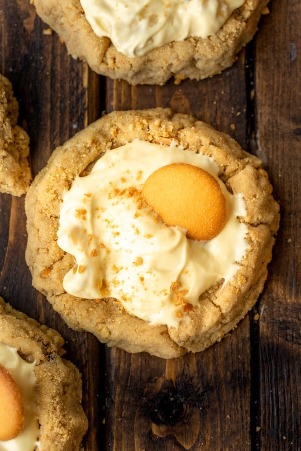 a photo taken over the top of a banana cream pie cookie topped with a Nilla wafer and graham cracker crumbs a photo taken over the top of a banana cream pie cookie topped with a Nilla wafer and graham cracker crumbs