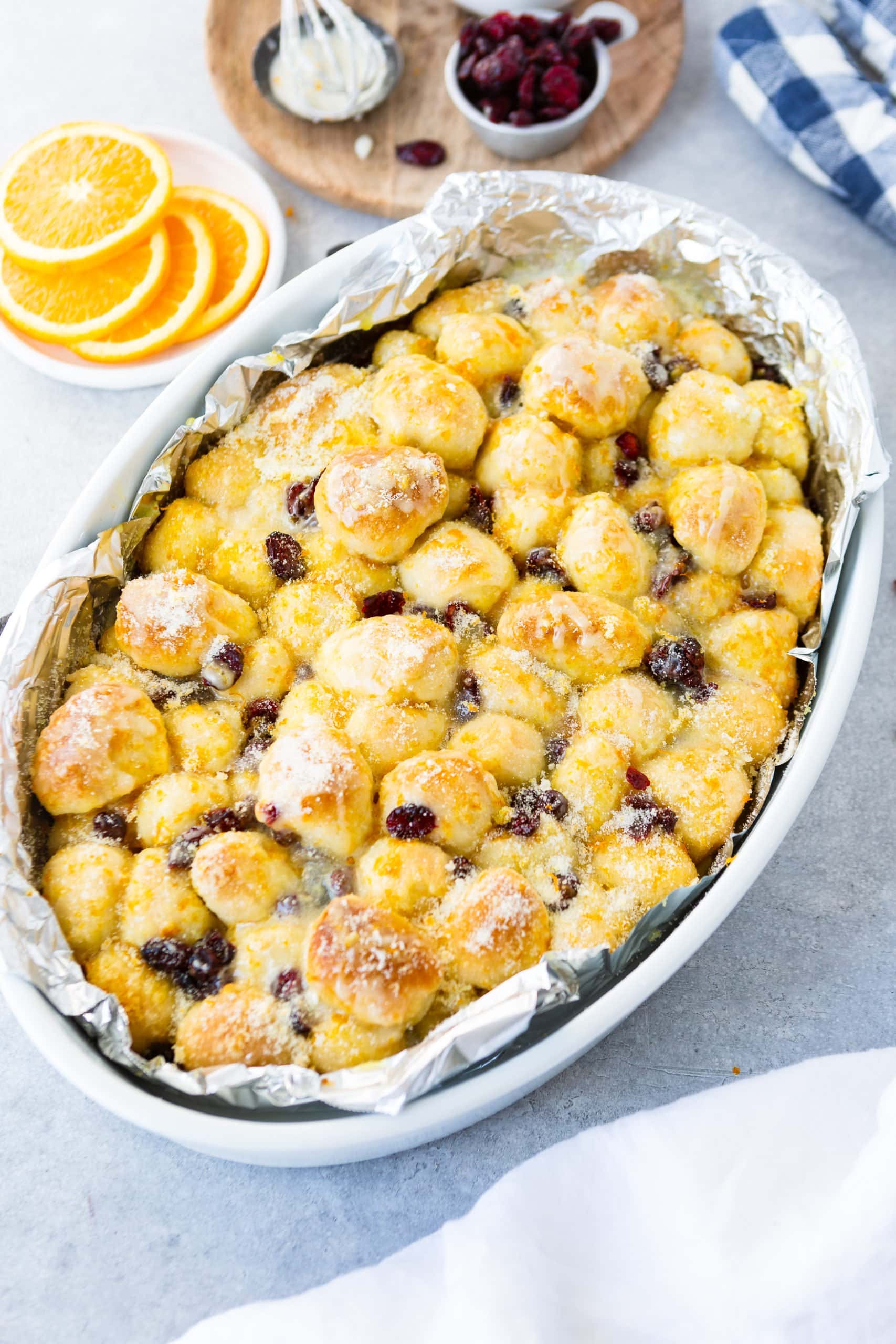 a casserole dish of orange craisin pull apart monkey bread a casserole dish of orange craisin pull apart monkey bread
